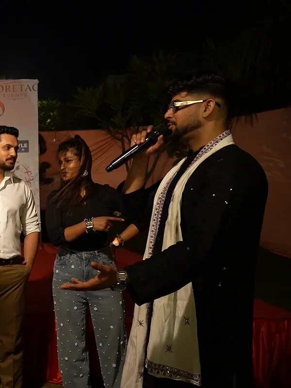 Ashish on the mic addressing guests on stage at Suncity Garba Ni Raat 2.0
